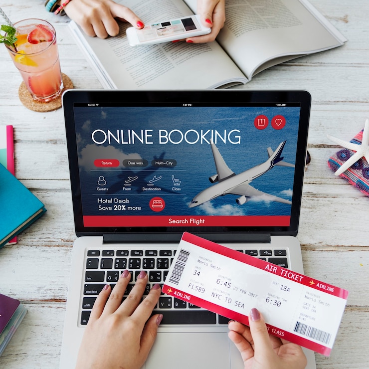 a person holding a ticket and a laptop