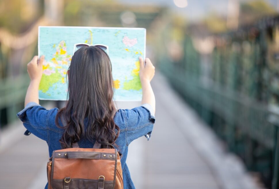a woman holding a map